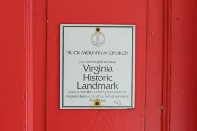 Plaque on the front door of the sanctuary announcing that "Buck Mountain Church has been registered as a Virginia Historic Landmark pursuant to the authority vested in the Virginia Historic Landmarks Commission Act of 1966"