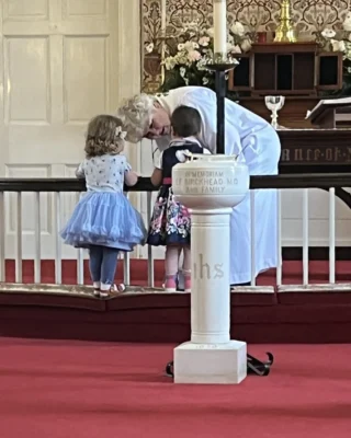 Mother Mary greeting children who joyously ran up to the altar rail on Easter